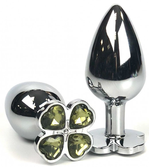 Серебристая анальная втулка с клевером из желтых кристаллов - 9 см. Серебристая анальная втулка с клевером из желтых кристаллов - 9 см.