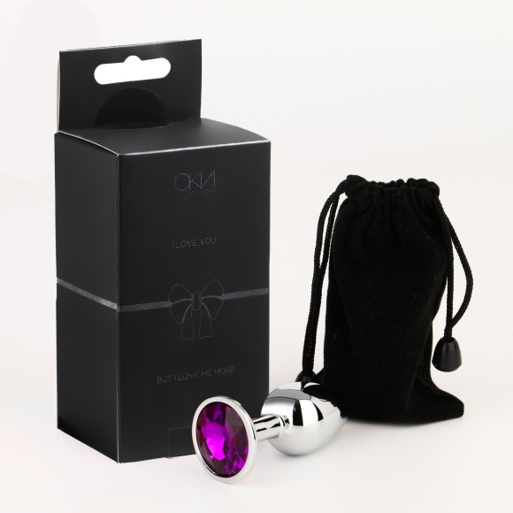 Серебристая анальная втулочка с фиолетовым кристаллом - 7 см. Серебристая анальная втулочка с фиолетовым кристаллом - 7 см.