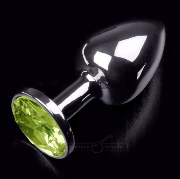 Маленькая серебристая анальная пробка с желтым кристаллом - 7 см. Маленькая серебристая анальная пробка с желтым кристаллом - 7 см.